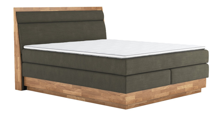 Boxspringbett VALMONDO Incana in einem Stoffbezug in Hunter und einem Sichtholzrahmen in Eiche