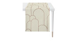 Tischläufer Vision 44 x 140 cm in beige liegend auf eienm Tisch.