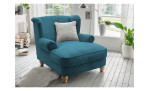 Loveseat-Sessel Bordeaux in der Farbe petrol mit einem silberfarbenen Kissen, in einem Raum stehend