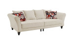 Big Sofa Pearl, Füße Schwarz, Rückenkissen in Bezugsfarbe sowie zwei Kissen mit floralem Muster, seitliche Ansicht