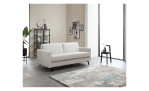 Schlafsofa Suva, in der Farbausführung grau / beige, in einem Raum stehend