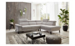 Komfort-Ecksofa, in der Farbausführung Silber, in einem Raum stehend ohne Kissen