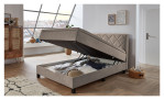 Boxspringbett Josh aus einem Mikrofaser Bezug in Beige mit schwarzen Füßen. Mit dem geöffneten Bettkasten
