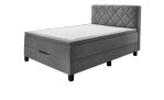 Boxspringbett Josh in einem silberen Bezug in mikrofaser und schwarzen füßen.