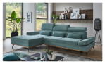 Wohnlandschaft Malie in einem Bezugsstoff in Aqua mit Zierkissen. Auf eindem dekorierten hintergrund.