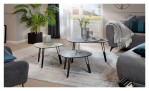 Couchtisch MONDO Varium mit einer Glas-Keramik Tischplatte in Silver mit einem schwarzren Stahlgestell.. Auf einem dekorierten Hintergrund.