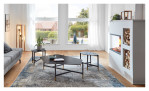 Couchtisch MONDO Varium mit einer Keramik Tischplatte in Marmoroptik Marquina und einem schwarzem Stahlgestell. Auf einem dekorierten Hintergrund.