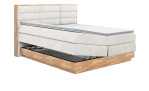 Boxspringbett VALMONDO Incana in einem Stoffbezug in Cream und einem Sichtholzrahmen in Eiche.Mit geöffneten Bettkasten