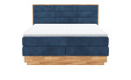 Boxspringbett VALMONDO Incana in einem Stoffbezug in Dark Blue und einem Sichtholzrahmen in Eiche