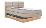 Boxspringbett VALMONDO Incana in einem Stoffbezug in Natural und einem Sichtholzrahmen in Eiche. Mit geöffneten Bettkasten