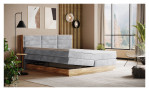 Boxspringbett VALMONDO Incana in einem Stoffbezug in Stone und einem Sichtholzrahmen in Eiche. Mit geöffneten Bettkasten