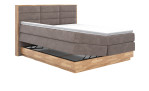 Boxspringbett VALMONDO Incana in einem Stoffbezug in Taupe und einem Sichtholzrahmen in Eiche. Mit geöffneten bettkasten