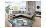 Komfort-Ecksofa vito Ticona, in der Farbausführung Silver / Olive, in einem Raum stehend