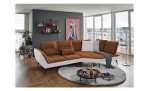 Komfort-Ecksofa vito Ticona, in der Farbausführung Kupfer / Silver, in einem Raum stehend mit der Rückenfunktion