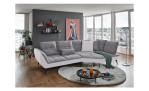 Komfort-Ecksofa vito Ticona, in der Farbausführung Silver, in einem Raum stehend mit der Rückenfunktion