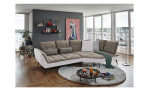 Komfort-Ecksofa vito Ticona, in der Farbausführung Taupe / Silver in einem Raum stehend