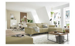 Komfort - Ecksofa Musterring MR 370, in der Farbausführung nature mit einem Hocker, in einem Raum stehend