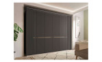 Komfort-Drehtürenschrank Musterring Isabelle, in der Farbausführung Graphit, in einem Raum stehend