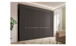 Basis-Drehtürenschrank Musterring Isabelle, in der Farbausführung Graphit, in einem Raum stehend