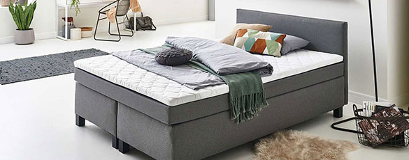 graues Boxspringbett - elegant und minimalistisch